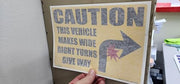 Caution vehicle makes wide right turns keep back right arrow decal