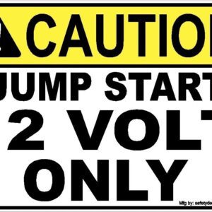 A caution sign that says, " caution jump start 12 volt only."