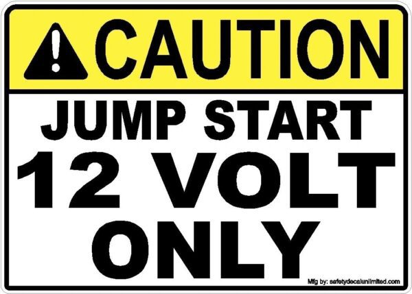 A caution sign that says, " caution jump start 12 volt only."