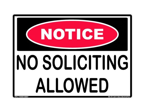 A sign that says no soliciting allowed.