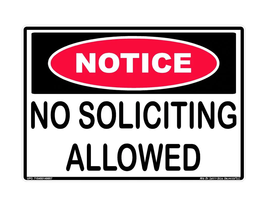 A sign that says no soliciting allowed.