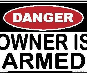 A danger sign that says owner is armed.