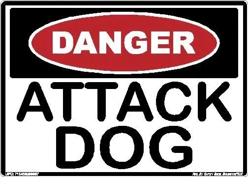 A red and white sign with the words " danger attack dog ".