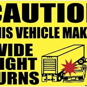 A yellow caution sign with black bold text that states Caution This Vehicle Makes Wide Right Turns. The 18 wheeler turning right and a red crash icon with a car in the side