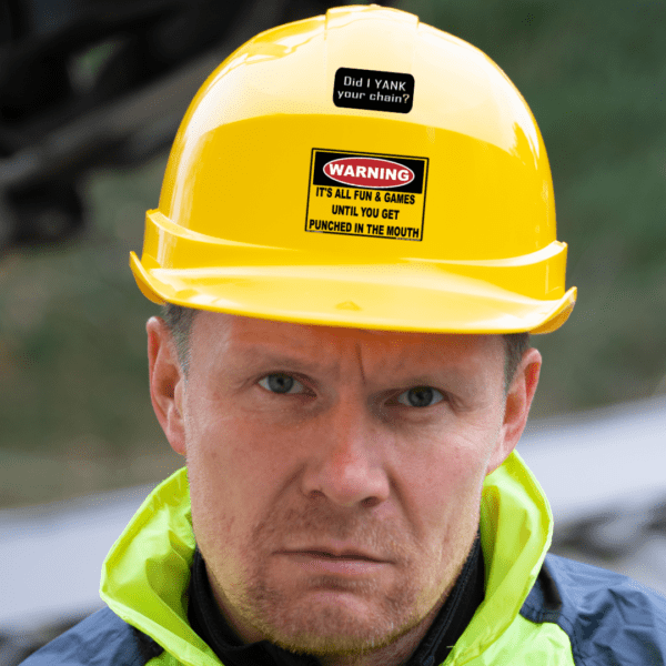 mean looking construction worker with a yellow hard hat